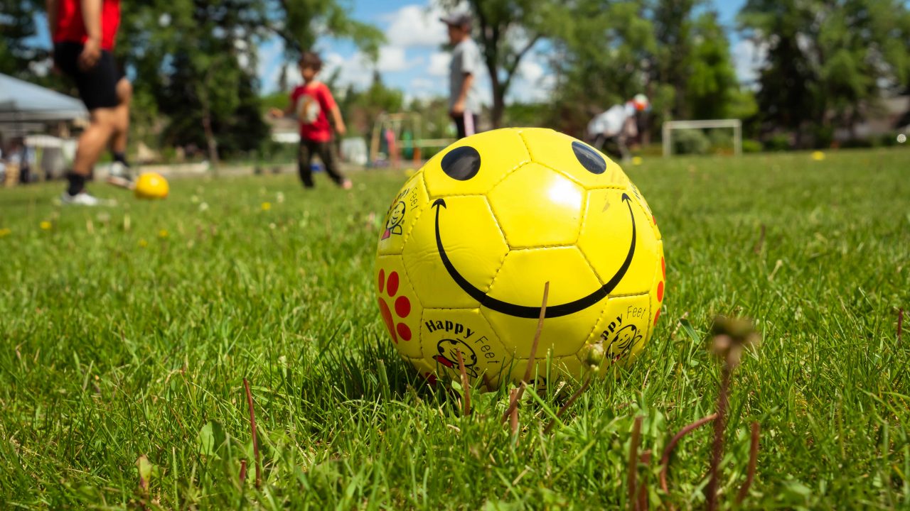 Soccer ball with a smiley face at a Neighbour Day event