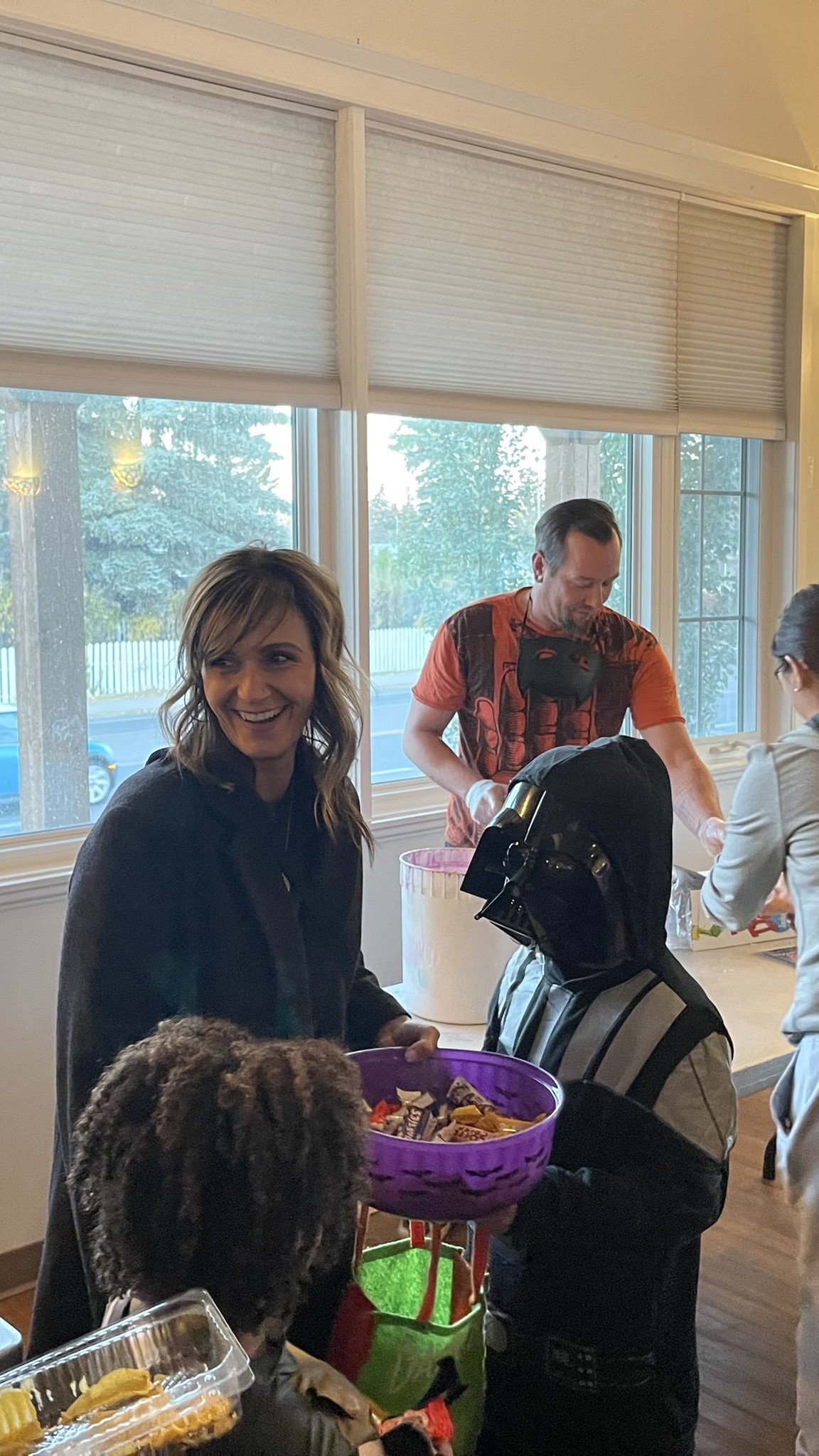 Councillor Sharp and Darth Vader handing out Halloween candy